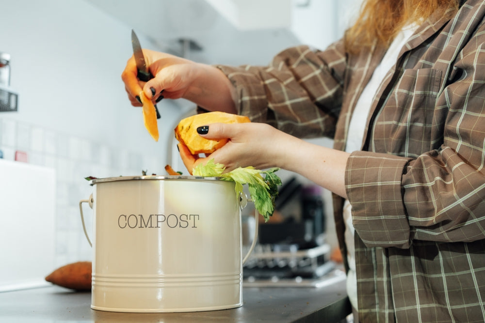 Composting kitchen waste.