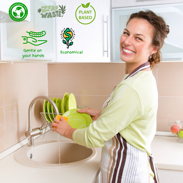 Woman washing plate using compostable kitchen sponge